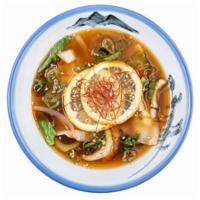Gyoza Spicy Soup · pork, green onion, ginger, garlic, cabbage, chicken broth, sesame, chili threads, lemon