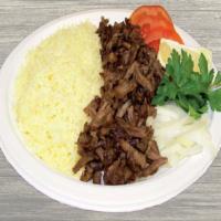 Steak Plate · Our special marinated steak, broiled on a vertical skewer, sliced bits, served with rice, pi...