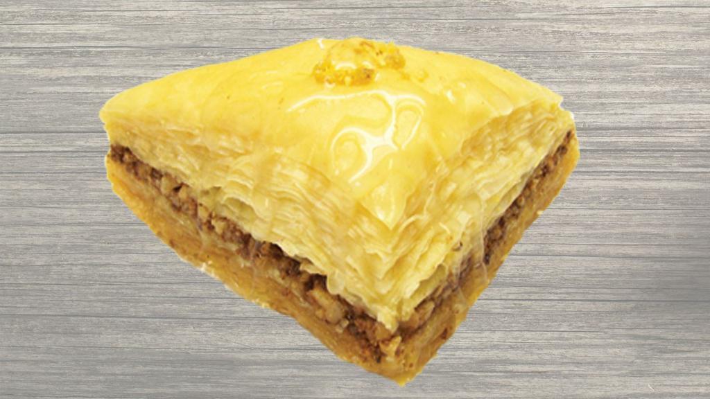 Baklava · A traditional Mediterranean sweet pastry.  Chopped walnuts, cinnamon, syrup, multilayers of Fillo dough.