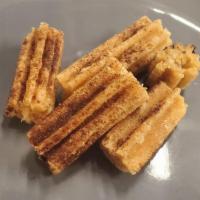 Churro Bites · Warm bites of yummy churro pastry tossed in cinnamon sugar.