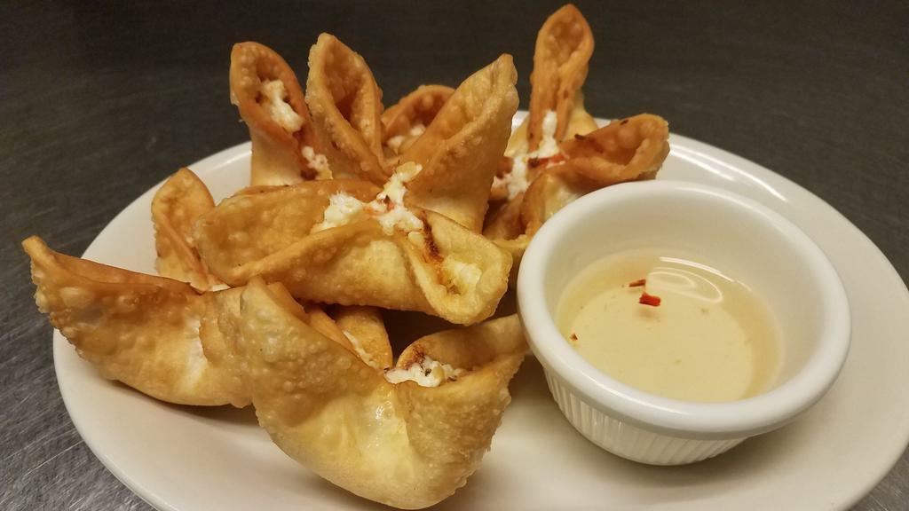Crab Rangoon · Five pieces. Cream cheese, imitation crab meat, and carrots.