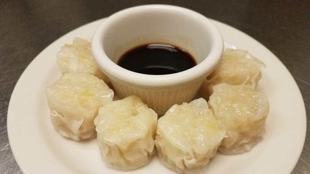 Shumai · Six pieces. Steamed dumpling stuffed with shrimp. Served with special sauce.