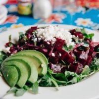 Ensalada De Betabel · Organic red beets, poblano chiles, avocado, red onion, cilantro, queso fresco, arugula, lime...