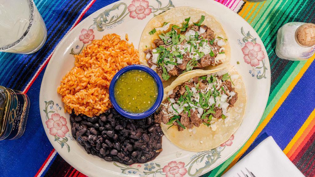 Carne Asada Taco Plate · Grilled Harris Ranch natural steak, white onion, cilantro, four mexican cheeses, salsa de tomatillo. Served with Spanish rice & vegetarian black beans.