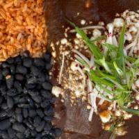 Mole Negro · Deep, dark, rich red mole with a small kick. Two enchiladas with your choice of filling serv...