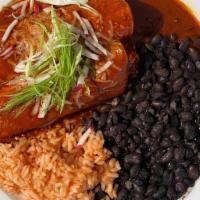Mole Coloradito · Classic red mole with a spicy kick. Two enchiladas with your choice of filling served with S...