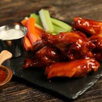 Sweet Chili · 8 sweet chili wings (mild heat), served with carrots & celery and a choice of blue cheese, c...
