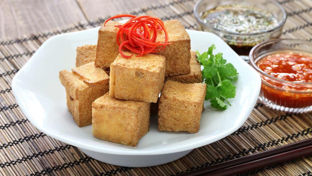 Fried Tofu With Sauce · Tofu fried to perfection and served with delicious dipping sauce.