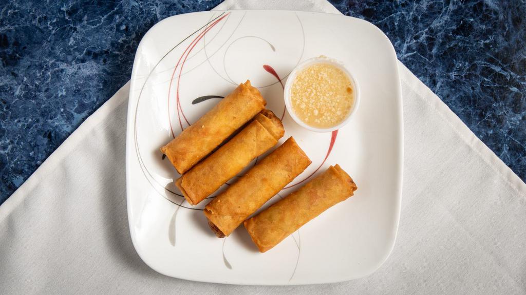 Spring Roll · Shredded cabbage, carrots, transparent noodles wrapped in an egg roll shell.