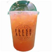 Strawberry Twist · Strawberry peach green tea with fresh Fruit bits and chia seeds.