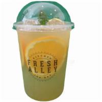 Kumquat Delight · Kumquat passion fruit green tea with fresh fruit bits and chia seeds.