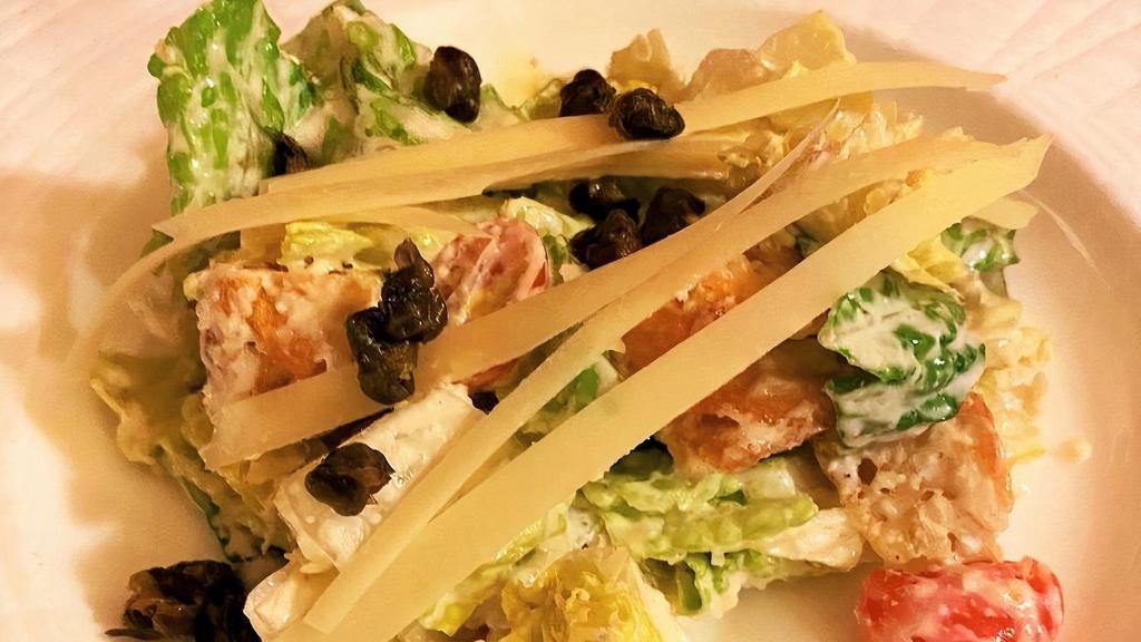 Insalata Cesare · Romaine lettuce, home-made moutons, cherry tomatoes, shaved parmesan cheese, and home-made caesar dressing.
