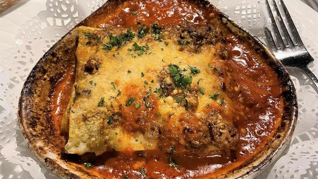 Lasagna Bolognese · Housemade lasagna with meat sauce, bechamel sauce and parmesan cheese