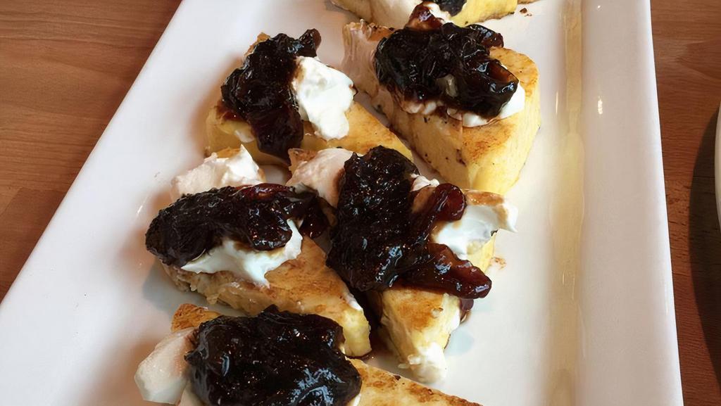 Goat Cheese & Polenta With Onion Marmalade · Creamy grilled polenta topped with chevre and onion marmalade.