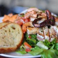 Chef Special · Spring mix salad with tomato, onion and house balsamic dressing topped  with grilled salmon,...