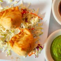 Samosa · Deep-fried crispy pastry of all-purpose dough filled with the stuffing made of mashed potato...
