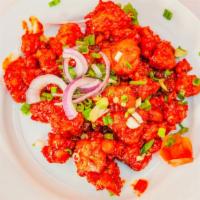 Gobi Manchurian · Indian Chinese fusion dish; fried coated cauliflower dashed with sweet & spicy sauces, fresh...