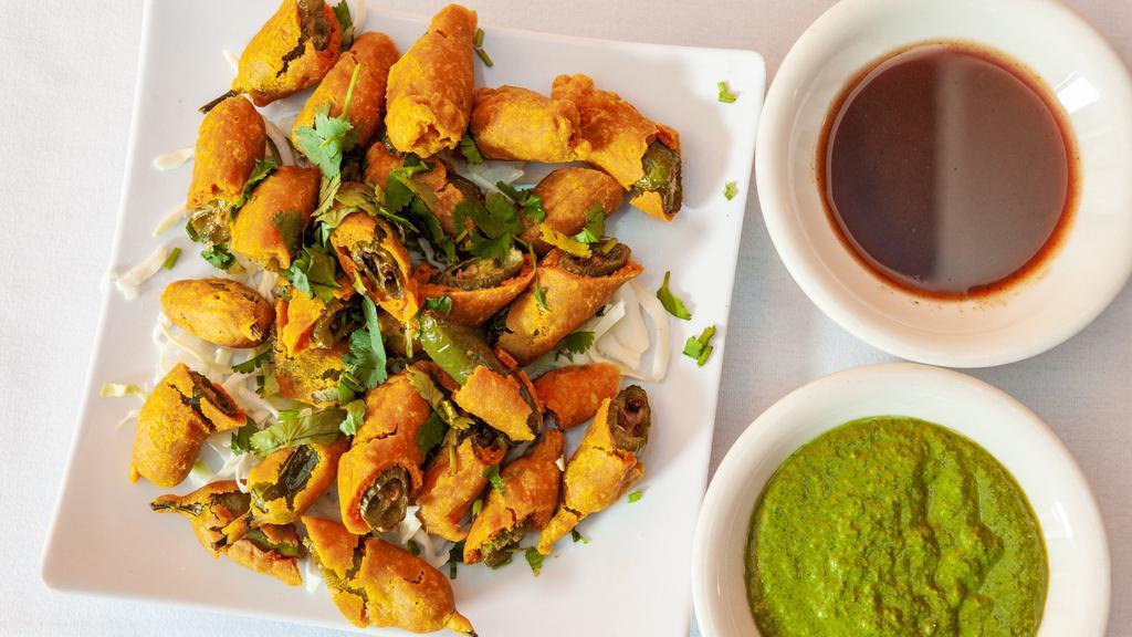 Cut Mirchi · A popular Indian street food made by frying battered green chilies.
