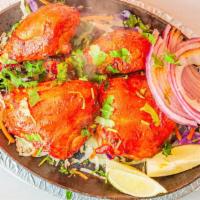 Tandoori Chicken · Minced chicken marinated in creamy yogurt sauce and grilled in clay oven for smoky flavor.