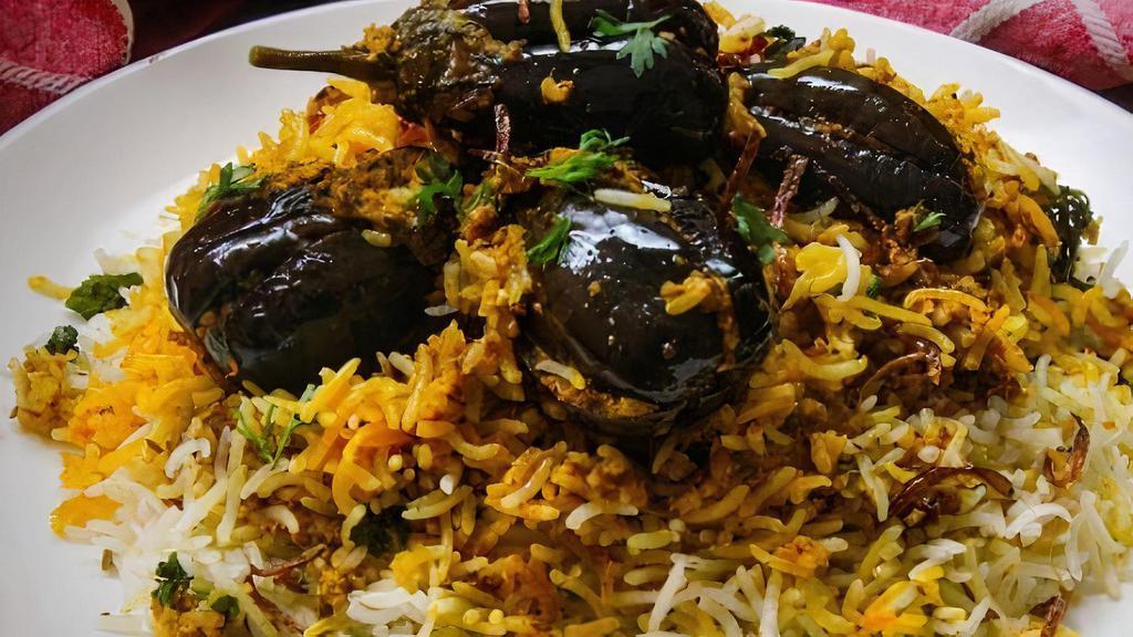 Gutti Vankaya Biryani · A perfect blend of traditional South Indian eggplant masala and aromatic basmati rice cooked for perfection.