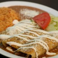 Enchiladas · 3 corn tortillas rolled around a filling covered in a savory sauce topped with cotija cheese...