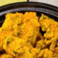 Paneer Pakora · Cheese and spices deep- fried in gram flour.