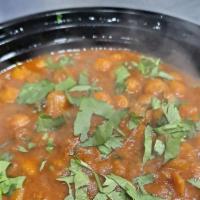Chana Masala · Gently cooked chickpeas sauteed in a curry with a blend of herbs and spices.