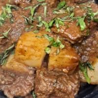 Lamb Vindaloo · Lamb cooked with potatoes and a special spicy sauce.