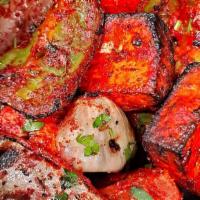 Paneer Tikka Kabob · Paneer, bell peppers, and onions marinated and cooked in our tandoori oven.