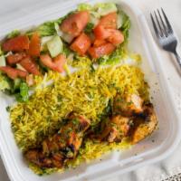 Chicken Kebab (Tawook) · Marinated chicken cubes in yogurt lemon juice and special spices char-broiled and served ove...