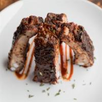 Half Rack Of Ribs · A natural, usda pork spare ribs
slow cooked with hickory.