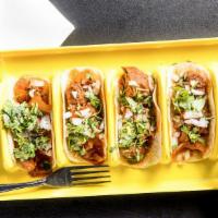 Street Tacos · 4 street tacos filled with the meat of your choice topped with onions, cilantro and served w...