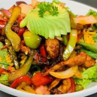 Fajita Salad · Gluten free. Served on top of “our traditional” garden salad. Garnished with avocado, tomato...