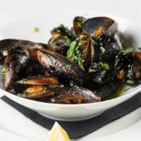 Impepata Di Cozze · Steamed mussels.