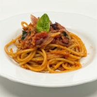 Bucatini Alla Matriciana · Bucatini pasta in a marinara sauce with red onions and pancetta