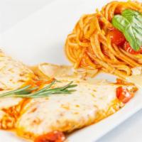 Chicken Parmigiana · Marinara sauce with mozzarella and spaghetti.
