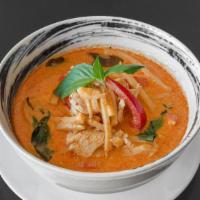 Red Curry · Red curry paste with coconut milk, bamboo shoots, bell pepper, and basil