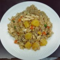 Pineapple Fried Rice · Fried rice with choice of meat, egg, carrot, green pea, and pineapple.