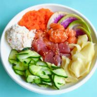 Rainbow Roll Bowl · Ahi tuna, salmon, cucumber, citrus ponzu, crab salad, ginger, masago, and sesame seeds.