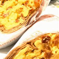 Breakfast Wrap · Scrambled eggs, bacon, cheddar cheese & tomatoes wrapped in a whole-wheat tortilla, served w...