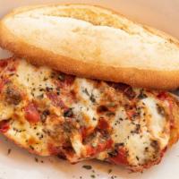 Meatball Grinder · Baked in our red sauce with fresh herbs, mozzarella and provolone cheese melting everywhere....
