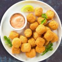 Tots To Ponder · (Vegetarian) Shredded Idaho potatoes formed into tots, battered, and fried until golden brow...