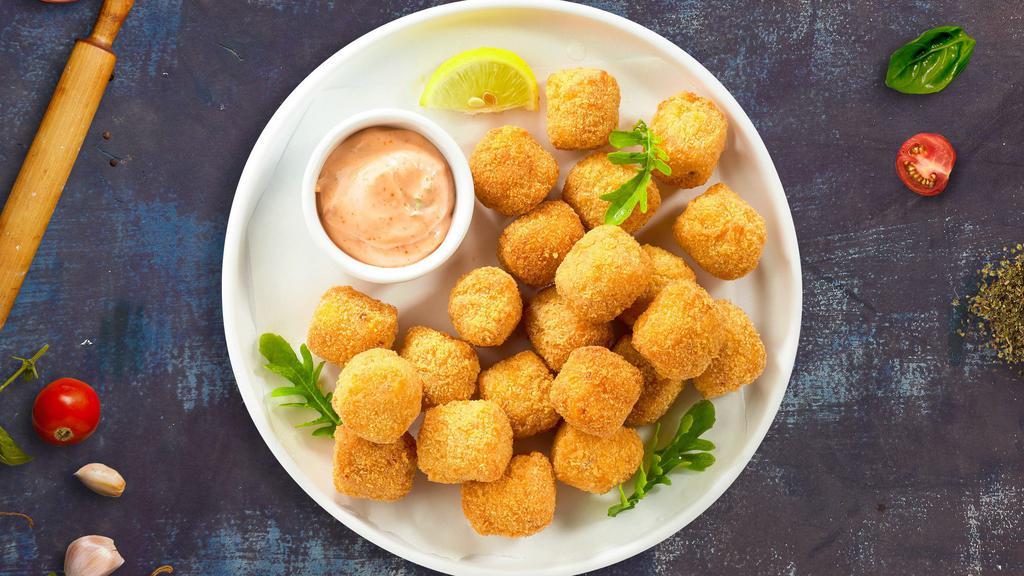 Tots To Ponder · (Vegetarian) Shredded Idaho potatoes formed into tots, battered, and fried until golden brown. Served with your choice of sauce.