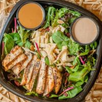 Thai Chicken Salad · Toasted Almonds, Dried Cranberries, Won Ton Strips & Grilled Chicken on a bed of Mixed Green...