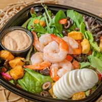 Shrimp Louie · Prawns on a bed of mixed greens with tomatoes, eggs, olives, and croutons, dressing of your ...