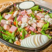 Cobb Salad · Bacon, Tomatoes, Eggs, Olives, and Blue Cheese Crumbles, on bed of Mixed Greens, topped with...