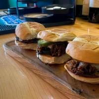 Sweet & Spicy Bbq Brisket Sliders · Slow cooked and pulled brisket lightly tossed in our sweet and smokey BBQ sauce and topped w...