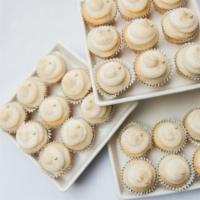 Mini Cupcakes (X-Small) · Nine Assorted mini cupcakes in a bakery box.