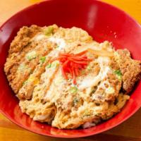 Katsu Donburi · Breaded deep fried pork loin with egg, vegetables over rice.