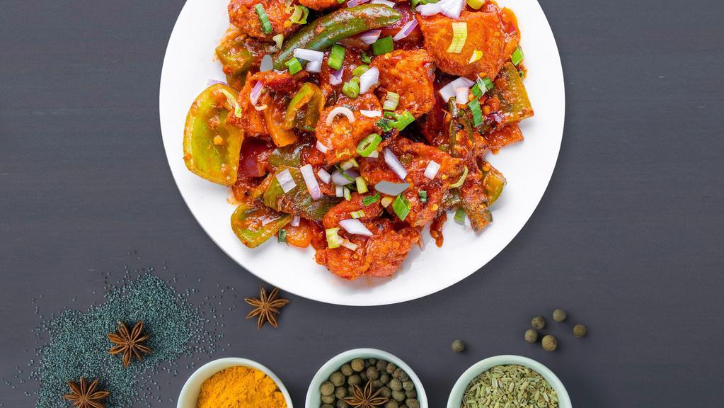Chicken Dance Chili · Marinated cubes of farm chicken, bell peppers, onions & tomatoes marinated in an Indian Chilli sauce